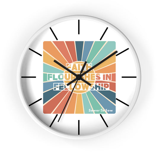 'Faith Flourishes in Fellowship' Wall clock with colorful design and text on a white background