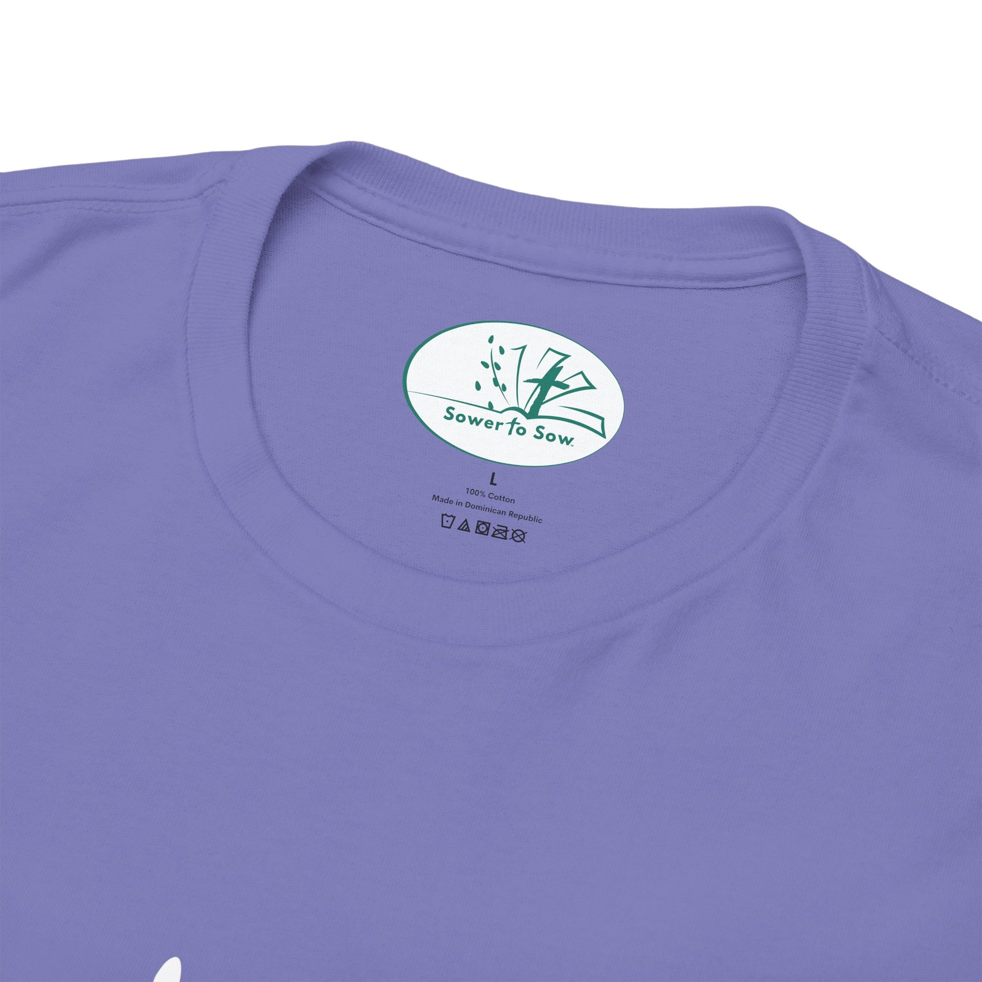 Purple t-shirt with a Sower To Sow logo and text on the collar area