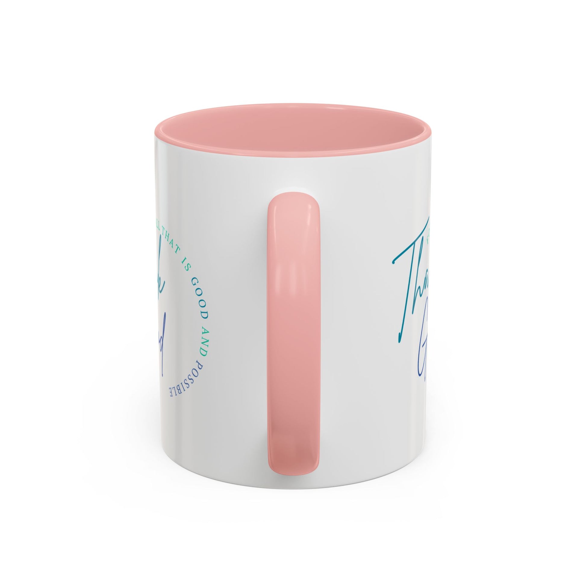 White mug with pink interior and handle on a white background