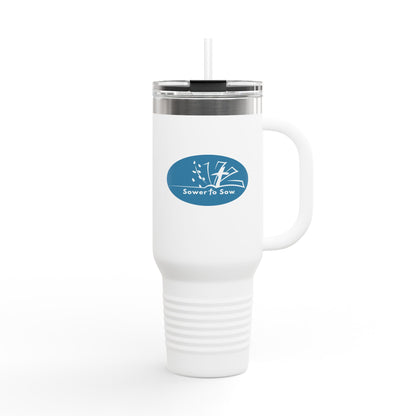 White travel mug with a blue logo on a white background from Sower To Sow